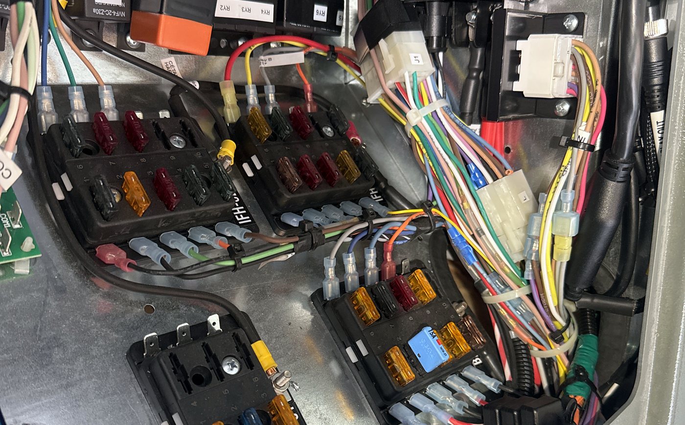 Organized fuse blocks and relays with every circuit terminated and labelled