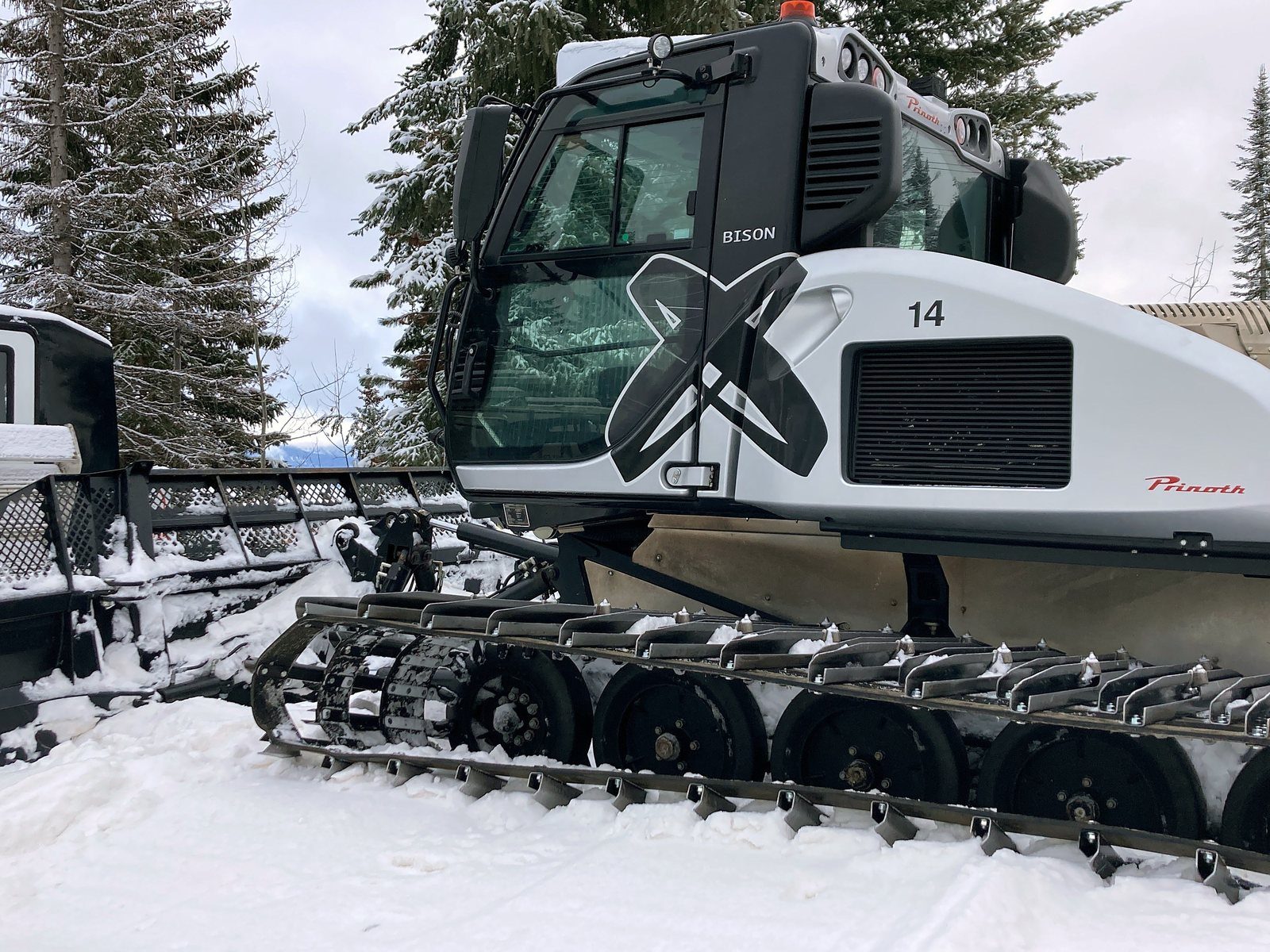 Tracked snowcat in the snow