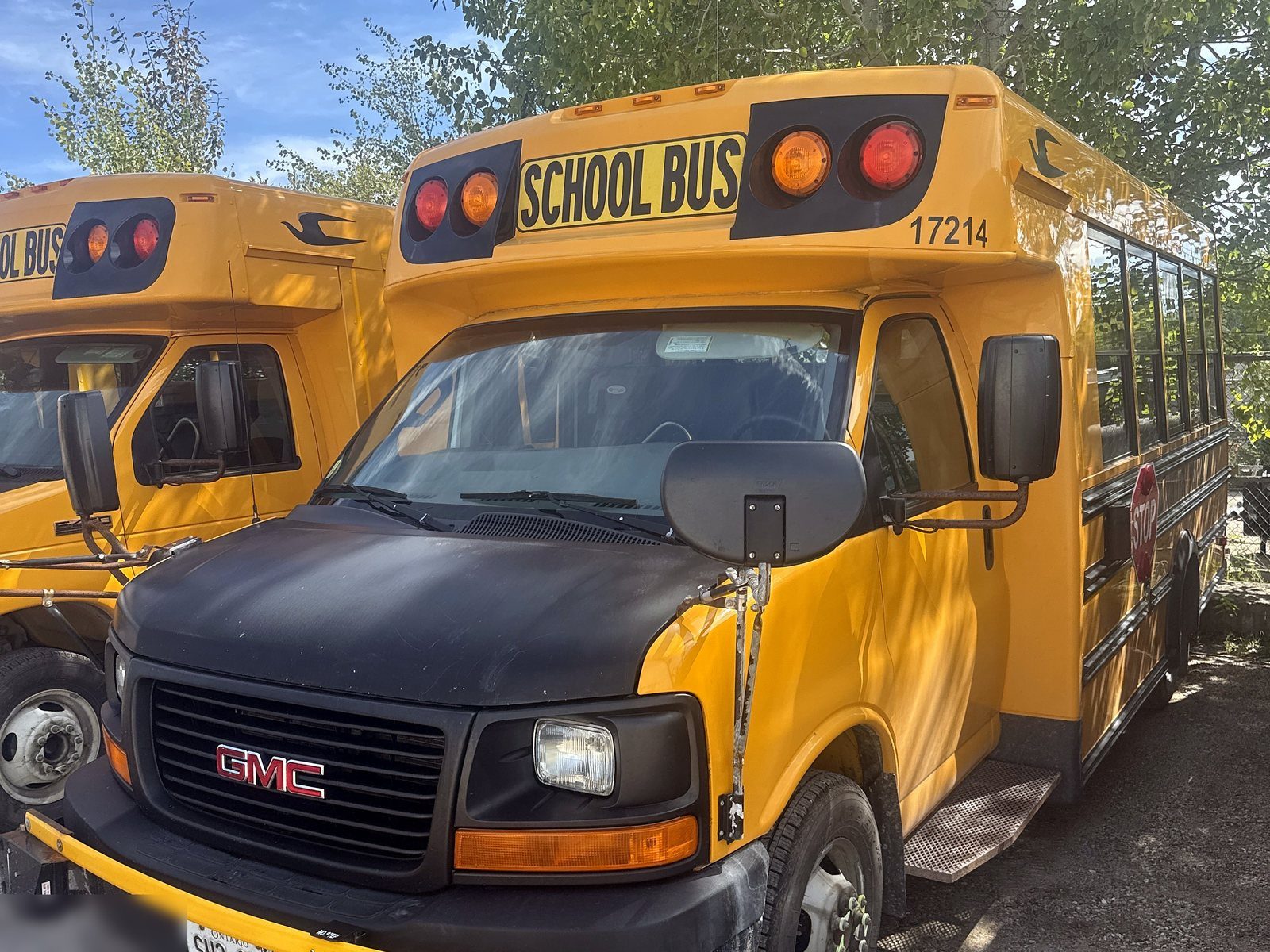 GMC school bus parked in the yard