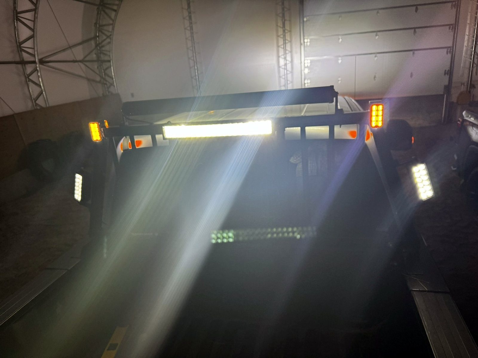 Pickup headache rack with light bar and work lights on
