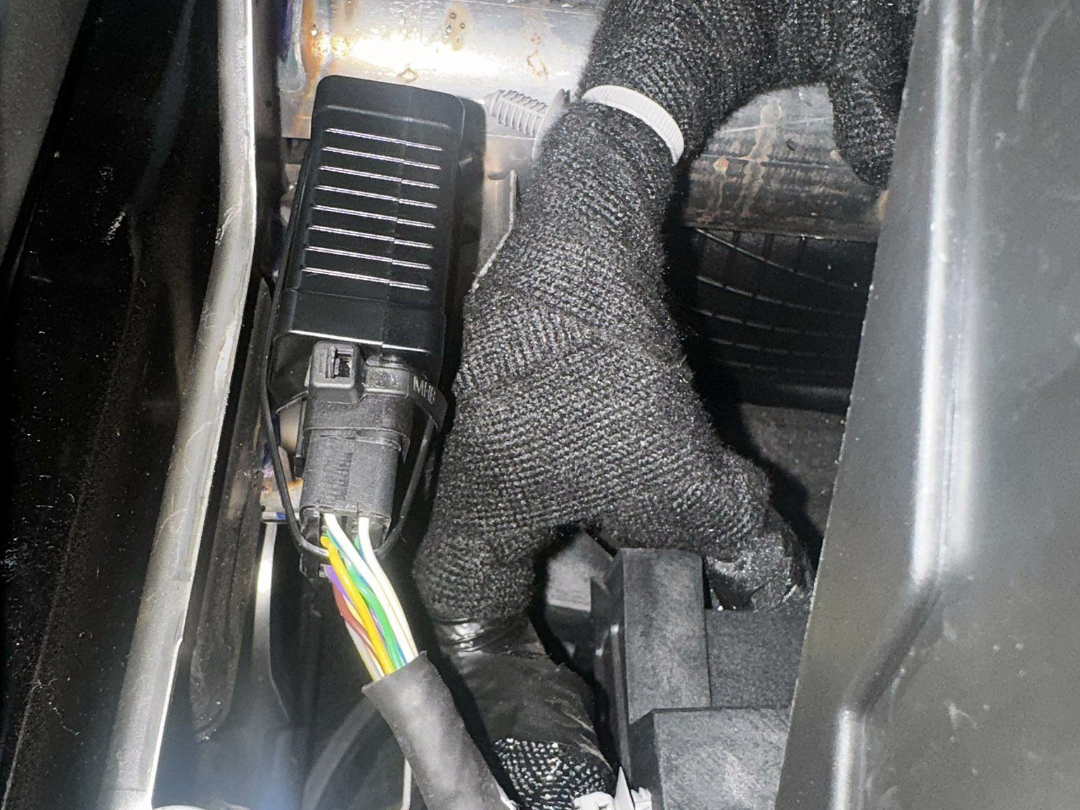 Hidden Fleet Command Center tracking device installed behind a pickup console