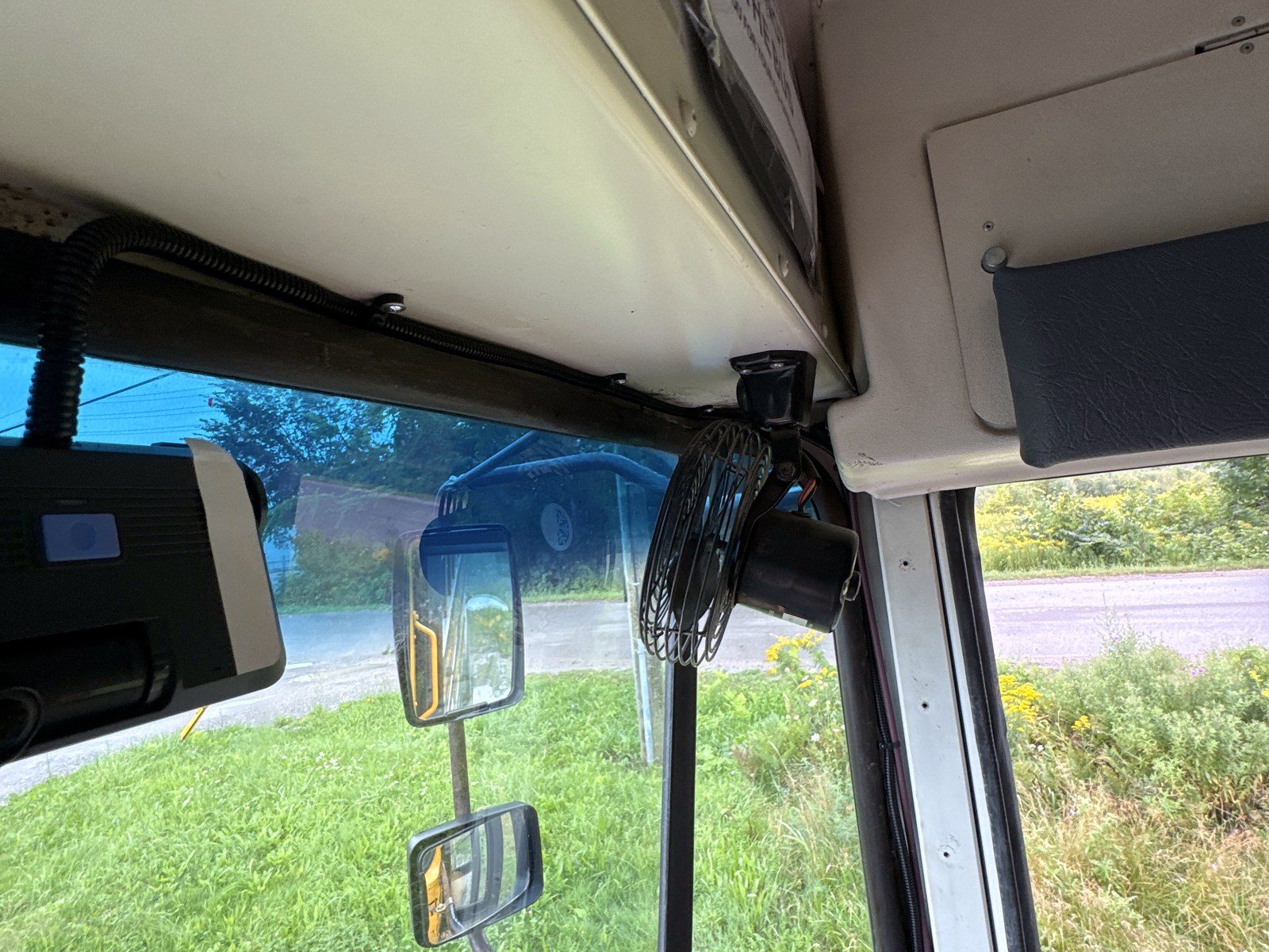 Dash camera mounted at the windshield header