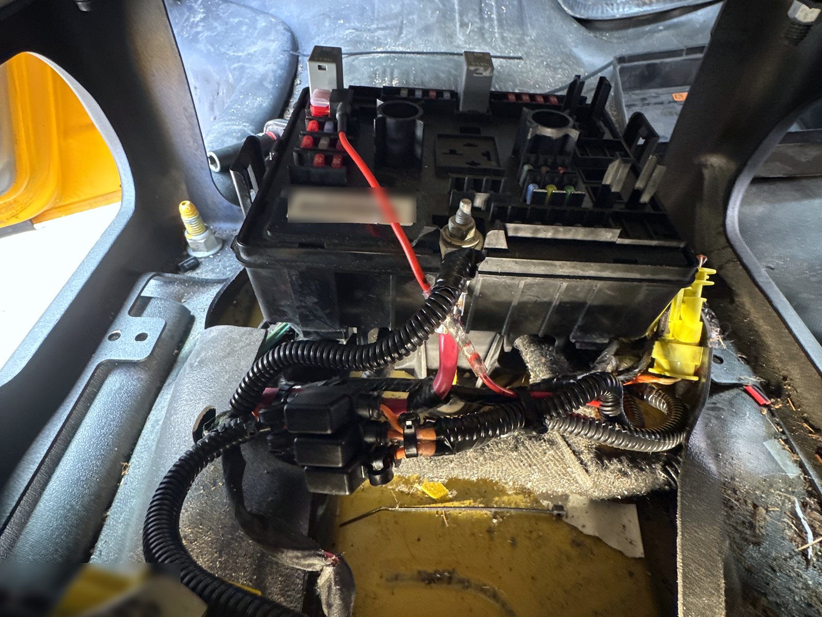 Under-seat fuse block with fused add-on circuits loomed and tied